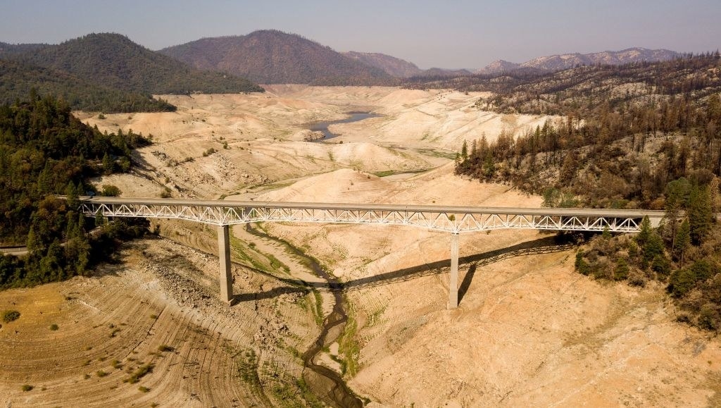 The bridge extends a significant distance, which used to be full of water, and now the water is so thin it&#x27;s barely visible