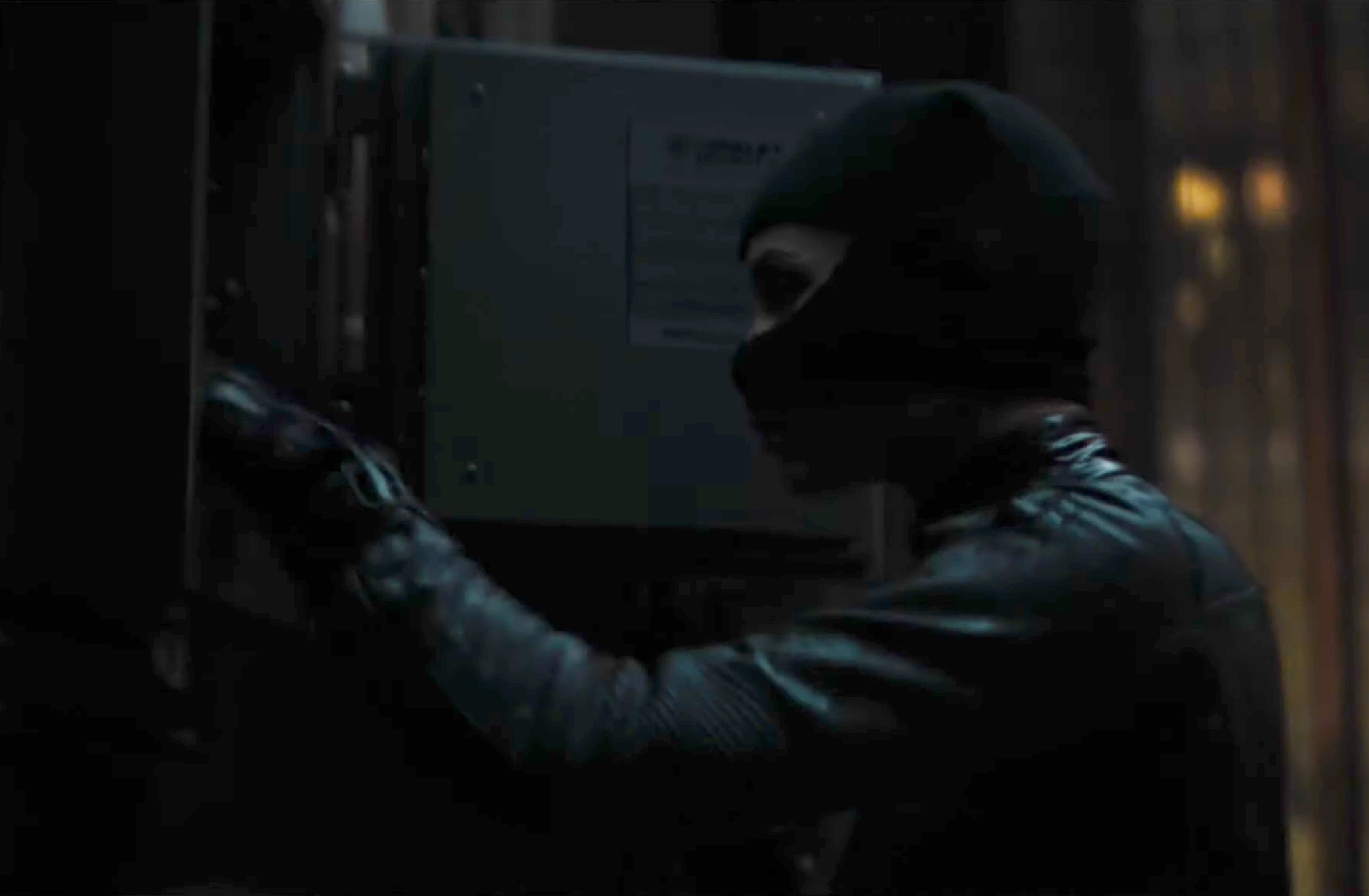 Burglar opening a safe