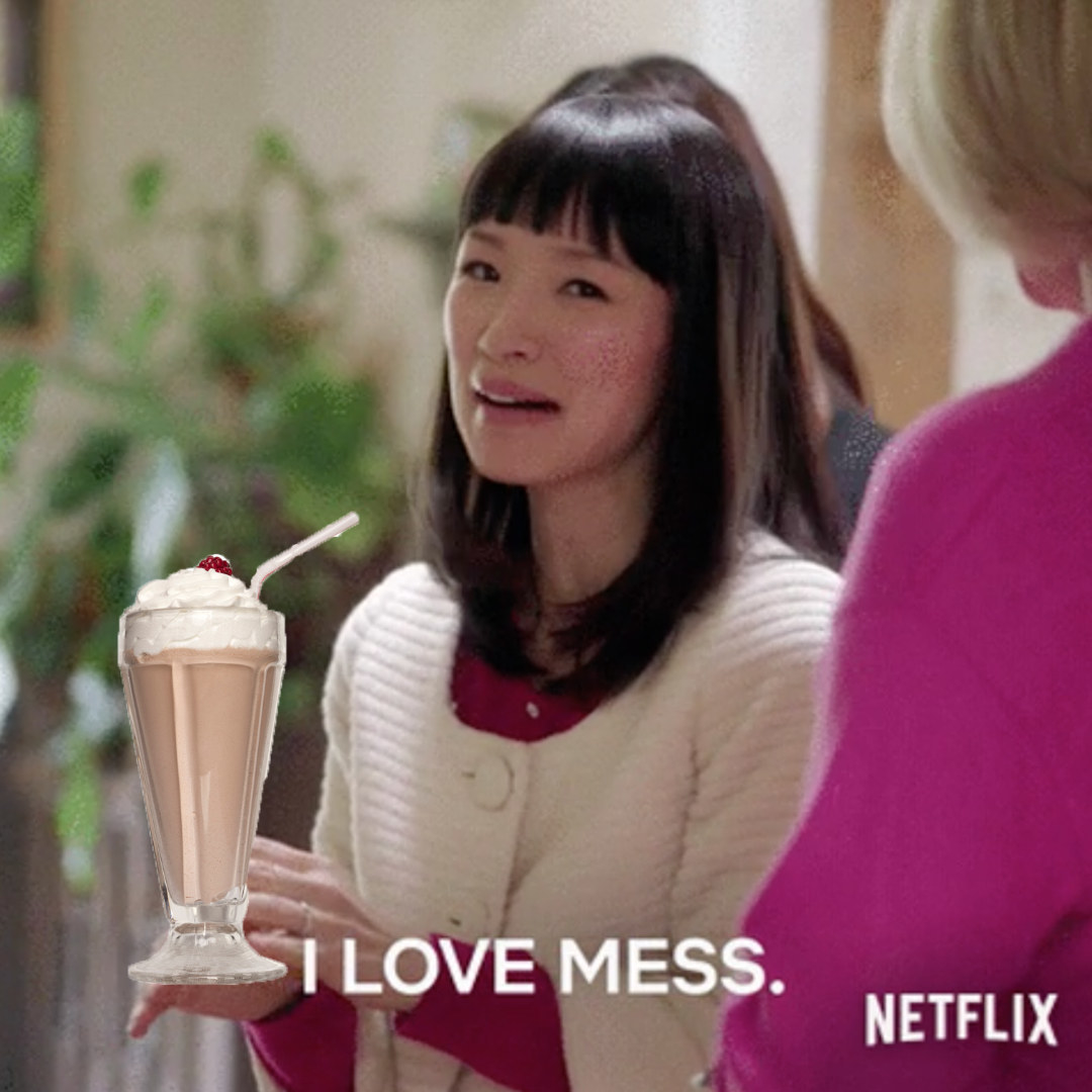 Marie Kondo holding a milkshake saying, &quot;I love mess&quot;