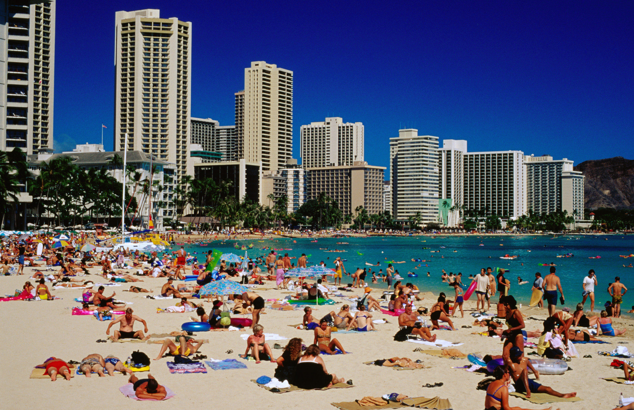Tourists on Waikiki beach in Honolulu