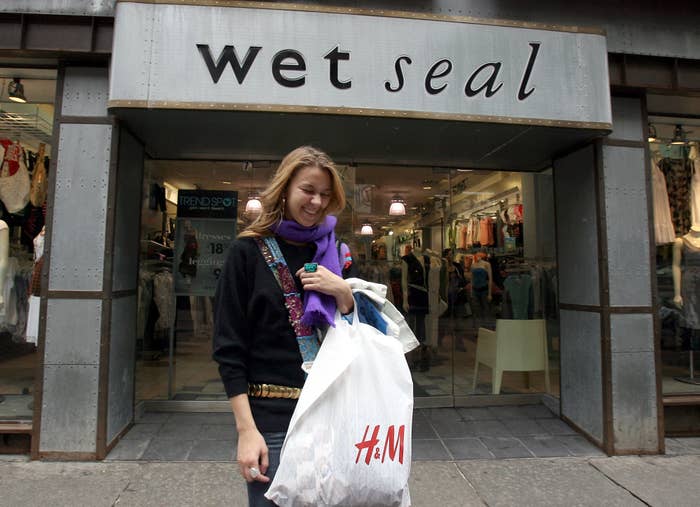 An H&amp;M shopping outside of a Wet Seal