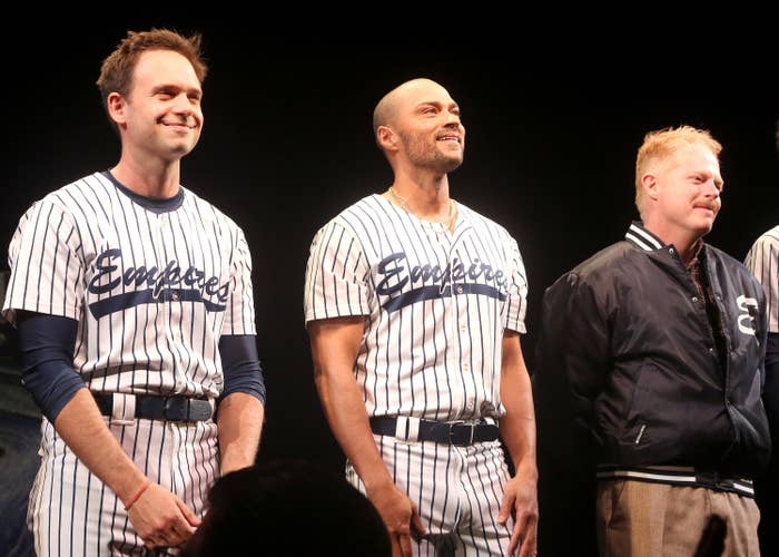 Jesse on stage in a baseball uniform