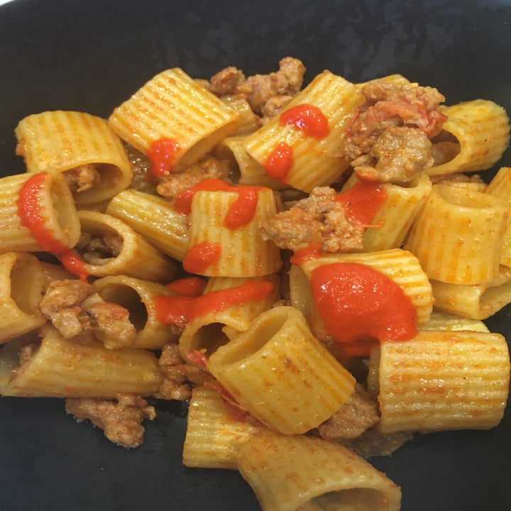 Some Truff hot sauce drizzled over noodles and sausage