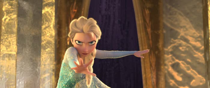 Elsa with her hand out to stop someone approaching
