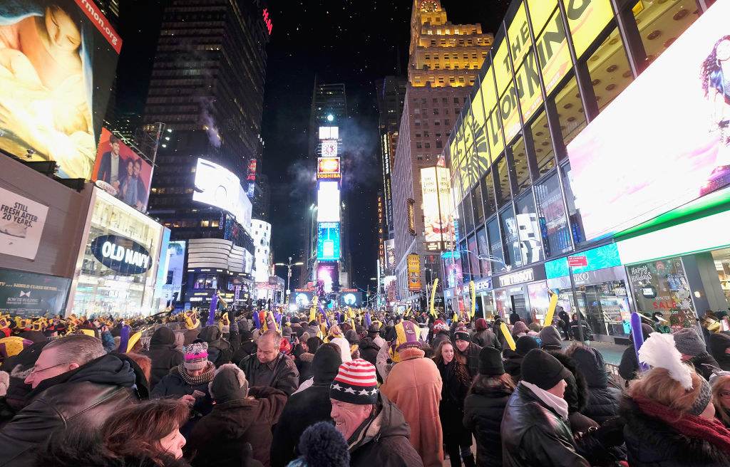 large crowd of people at night on Times Square