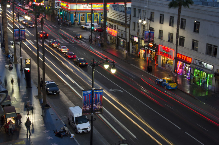 Hollywood Boulevard at night with cars at a stop light