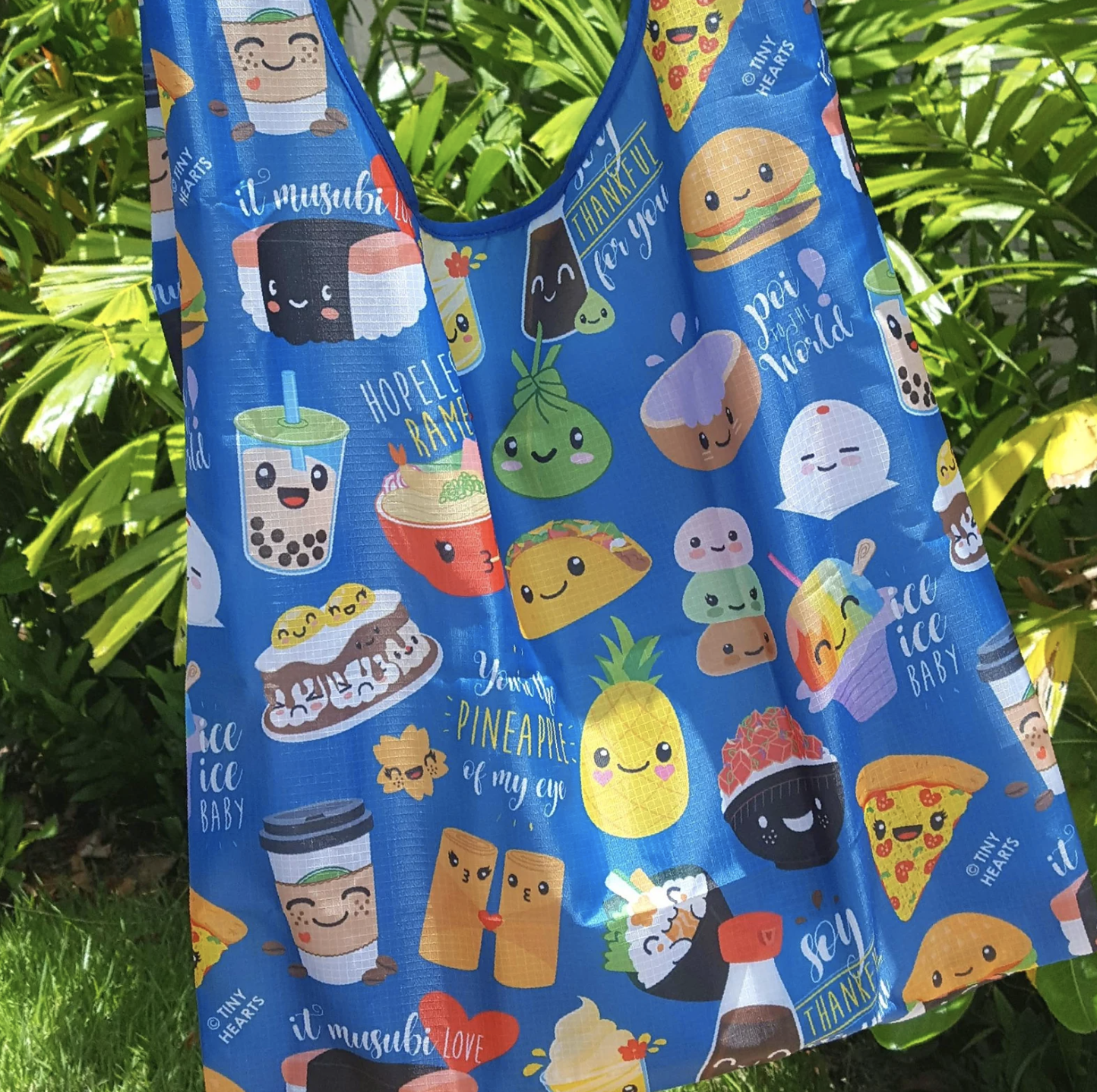 Nylon tote bag being with various smiling food characters.