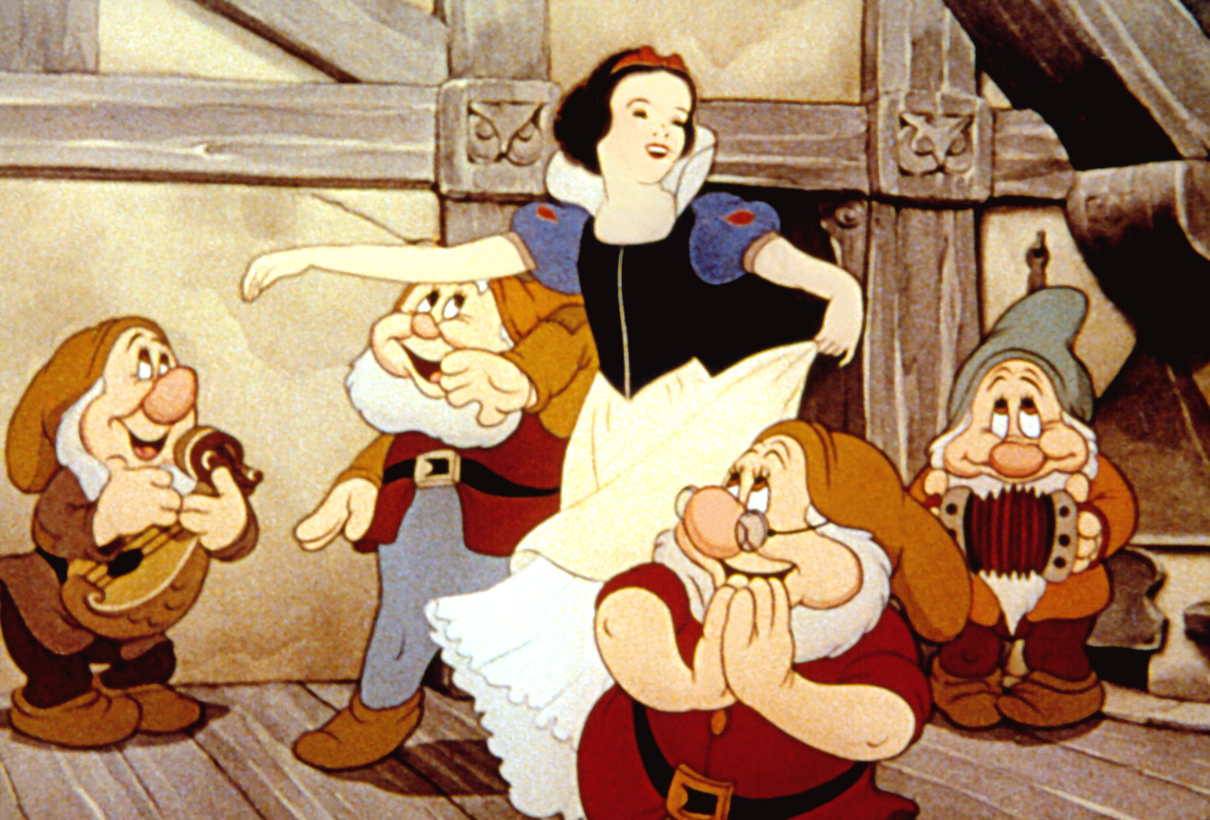 Snow White and four of the dwarfs dancing