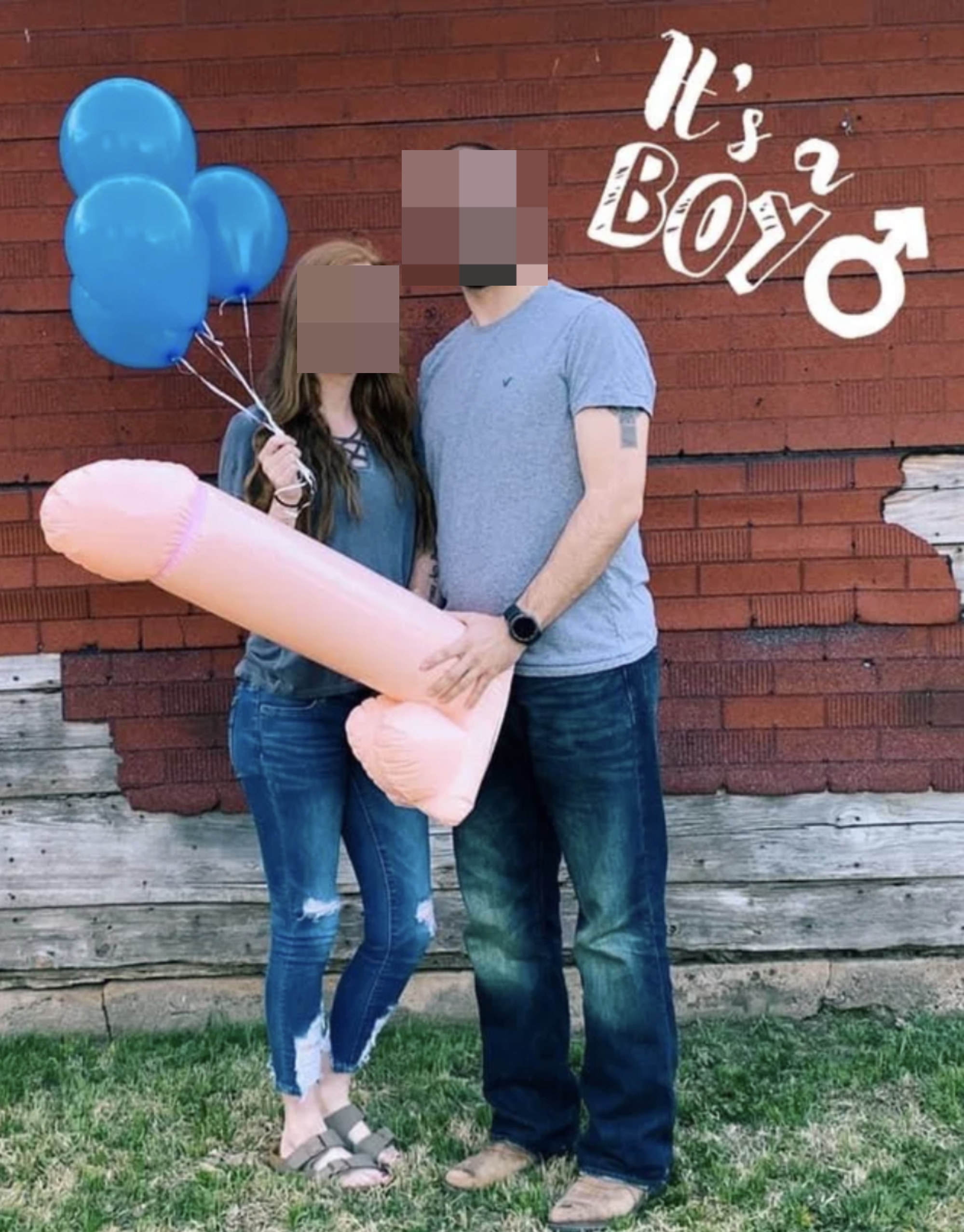 a guy holding a large blow up penis for the sex reveal
