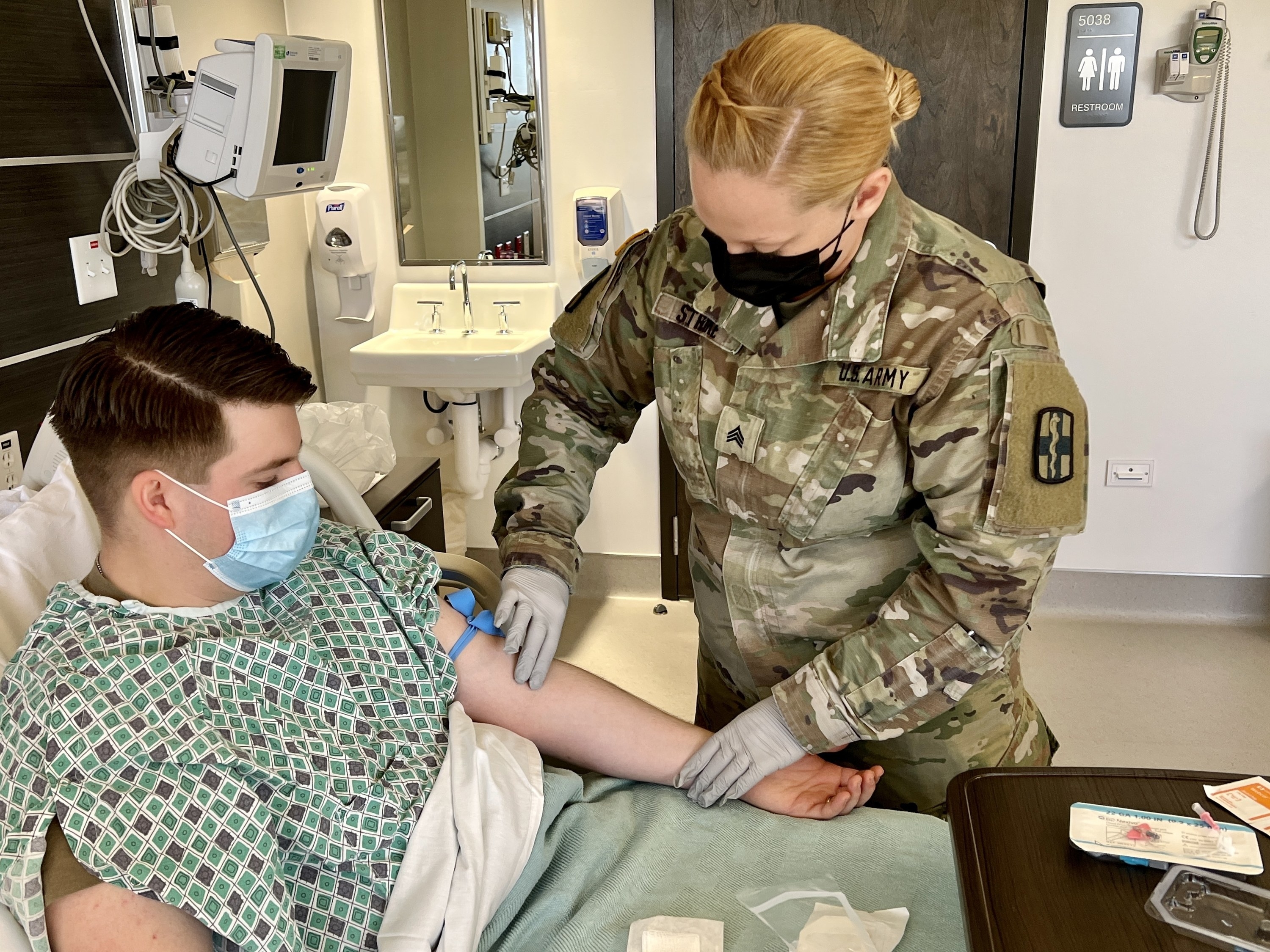 An Army doctor tends to a patient