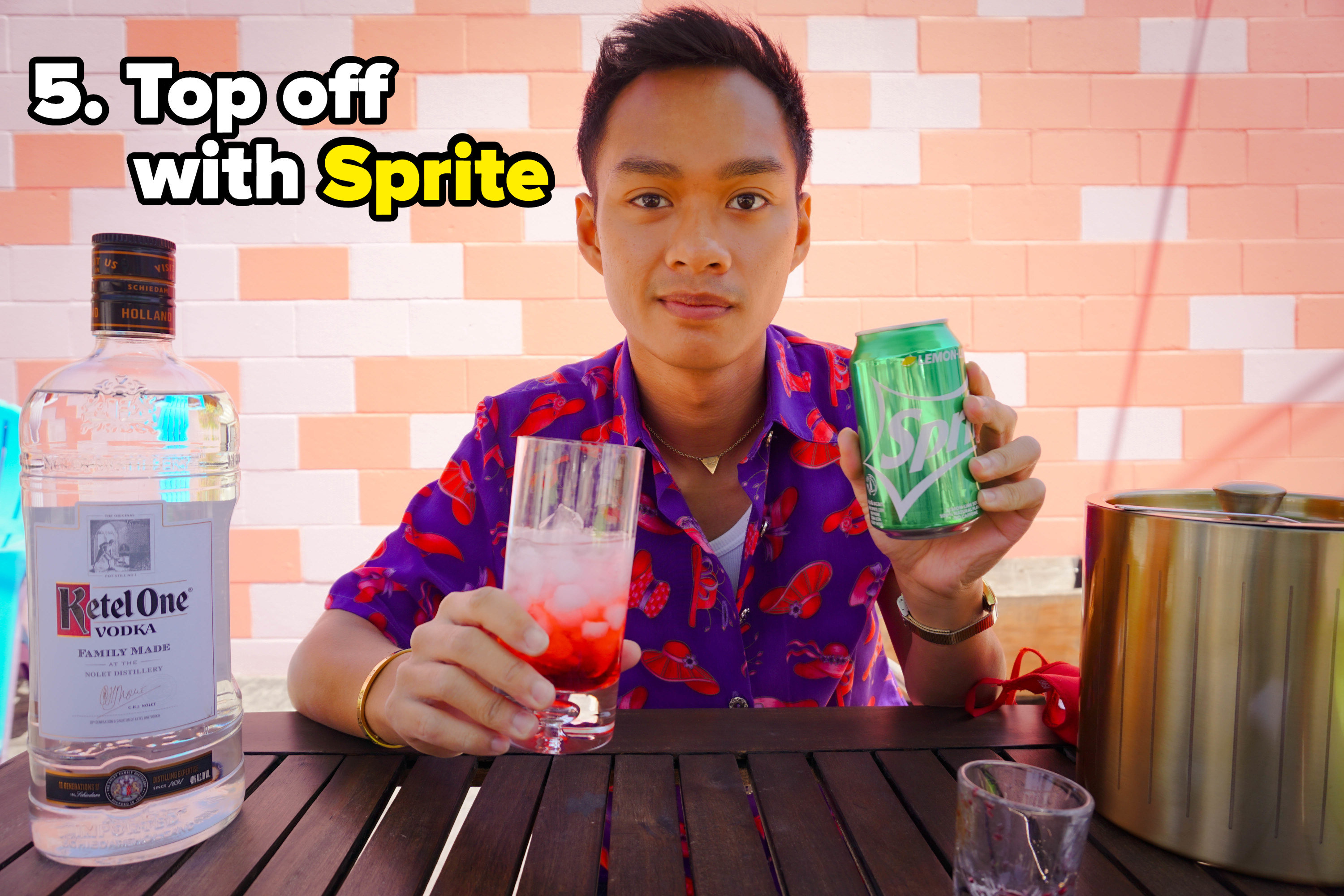author with a drink and a sprite can