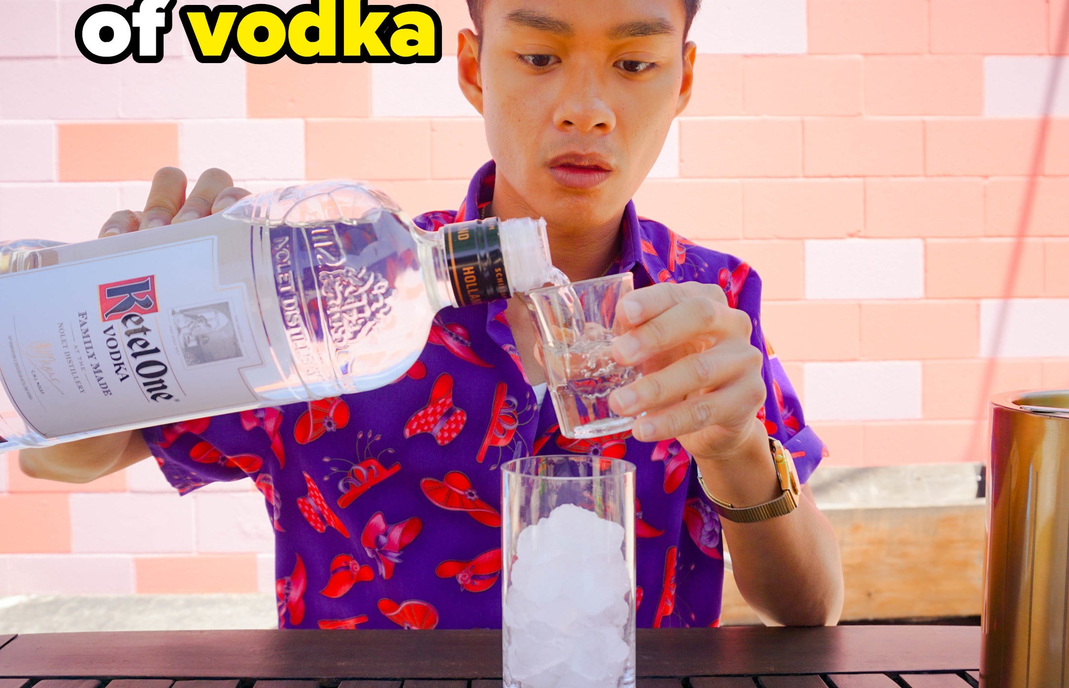 author pouring vodka into a shot glass