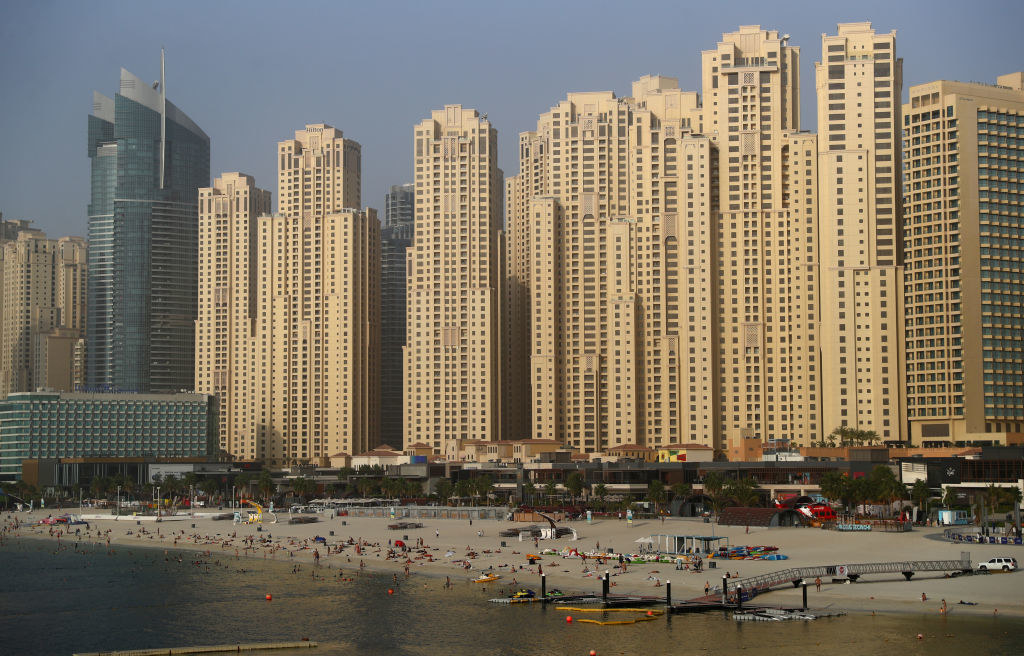 overlook of the beach and the tall building behind it