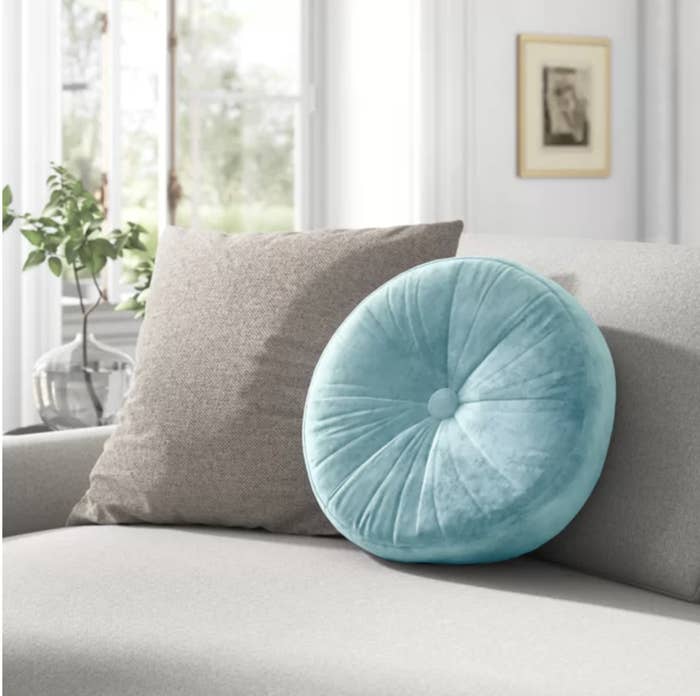The round cushion on a couch in a living room