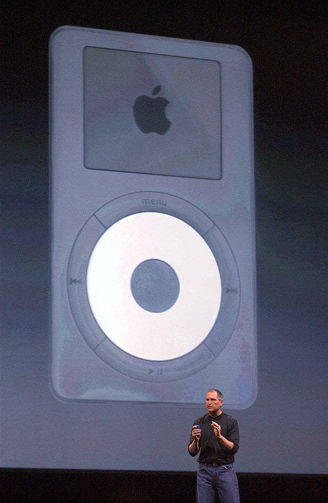 Steve Jobs onstage introducing an iPod
