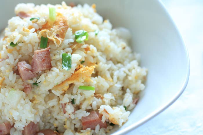 A close-up of spiced ham and egg fried rice