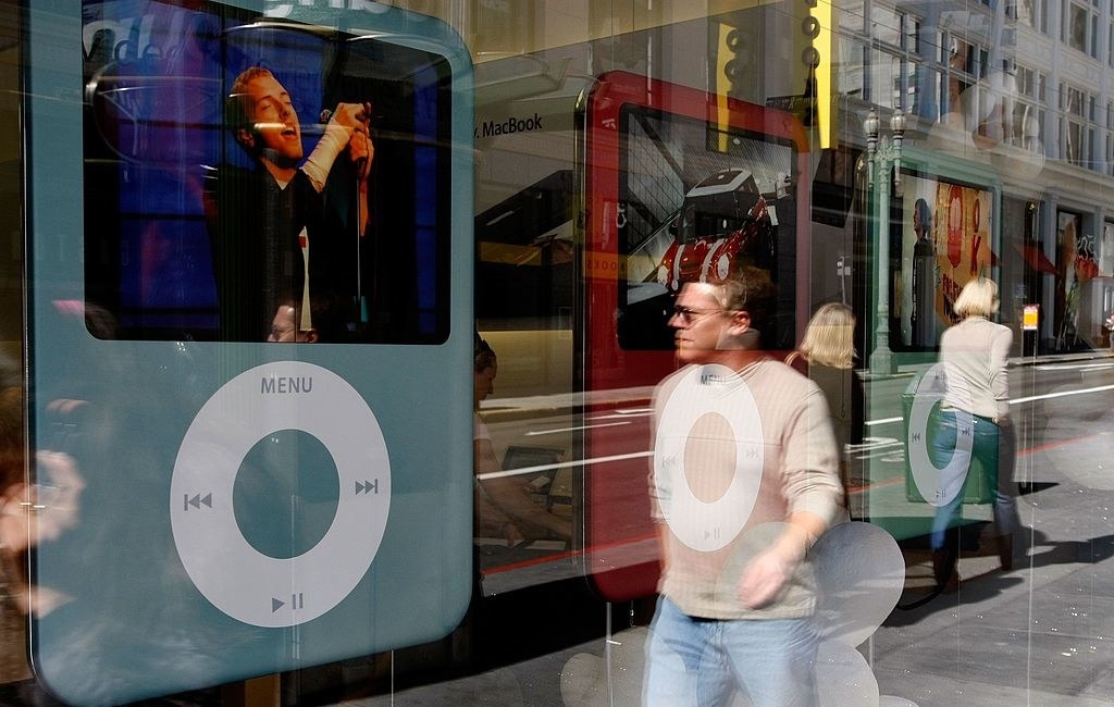 Person walking by an iPod ad