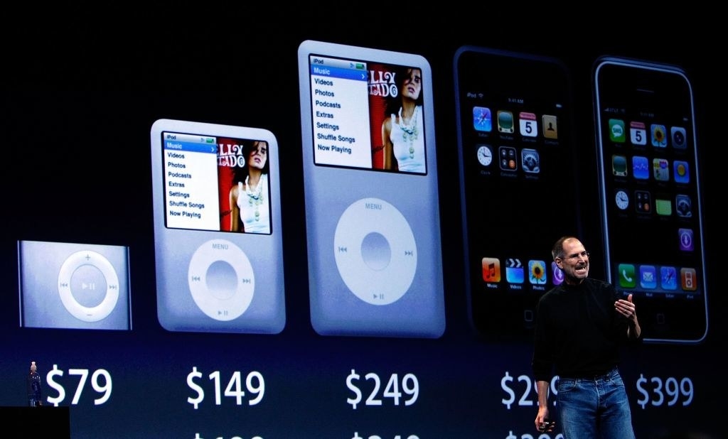 Steve onstage with iPods at different price points behind him