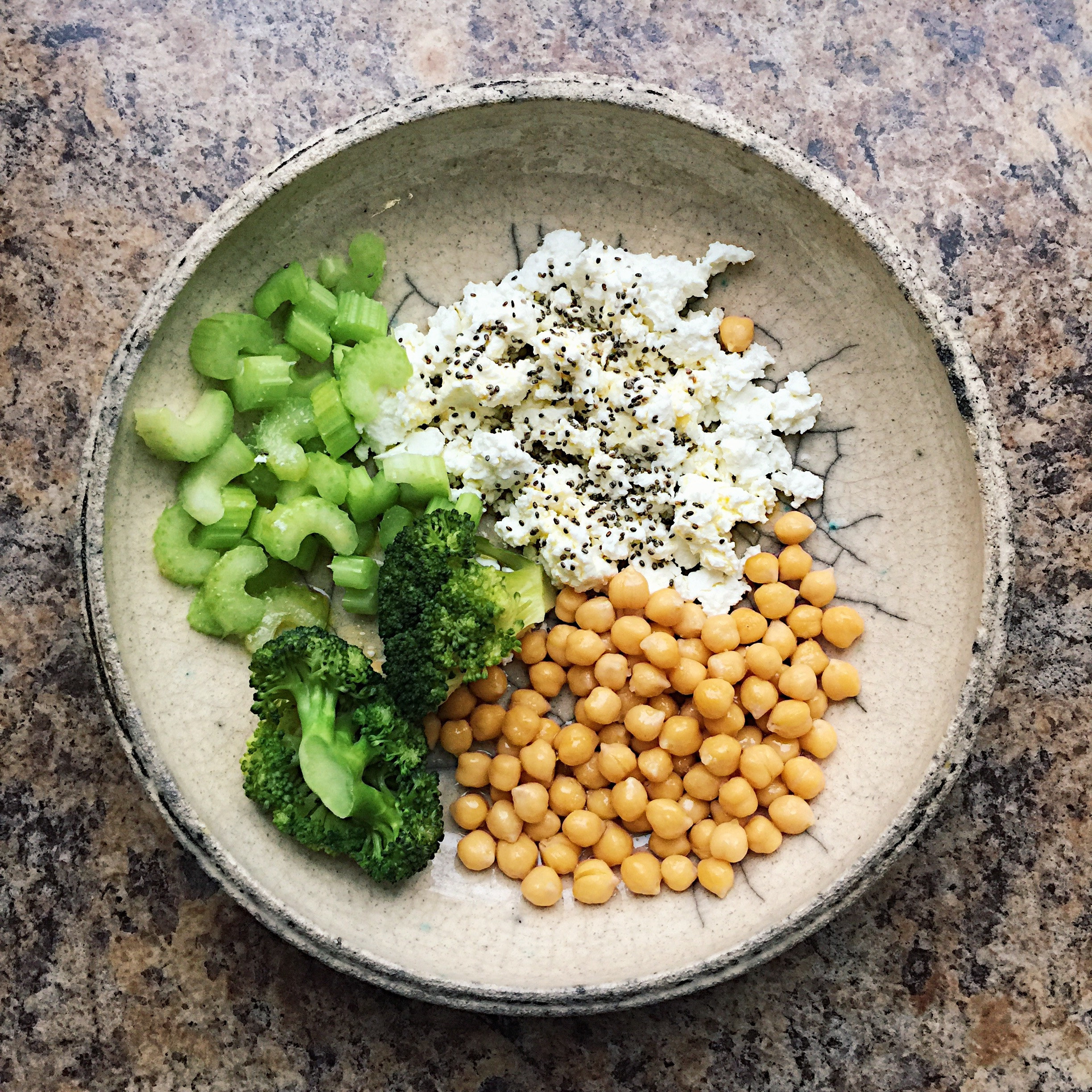 Cottage cheese with broccoli, celery, and chickpeas.