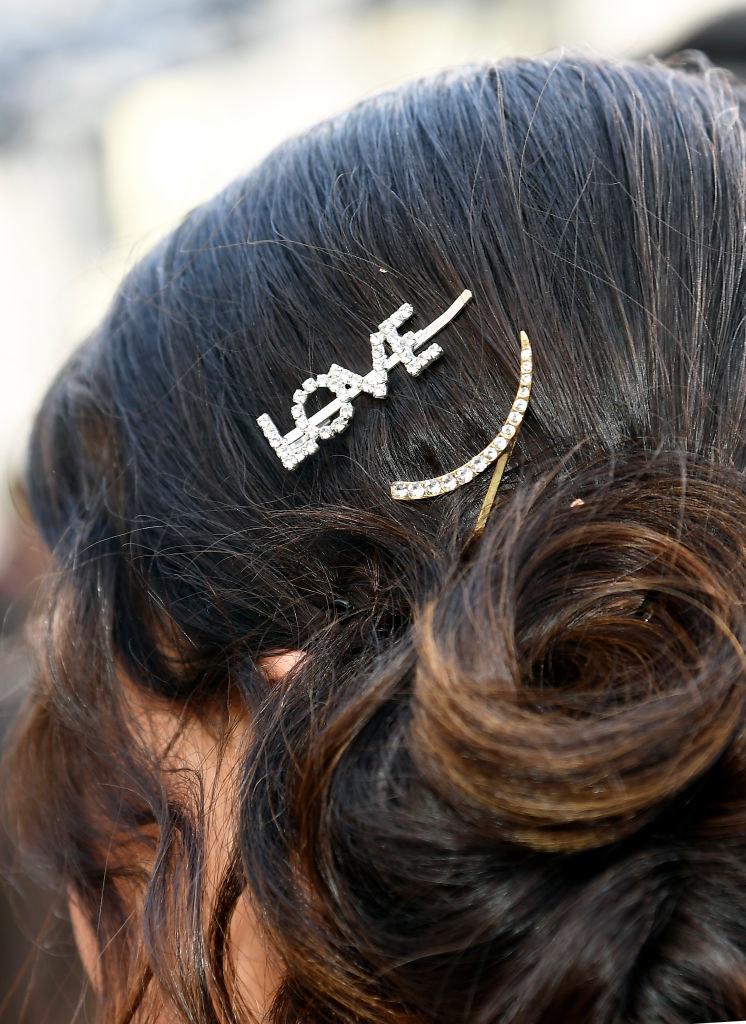 A closeup of Gemma&#x27;s hair with jeweled barrettes