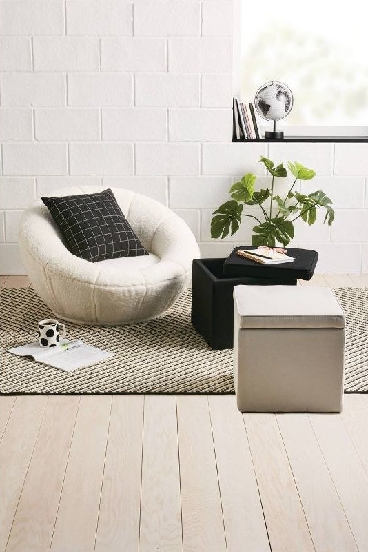 An image of a swivel Sherpa accent chair