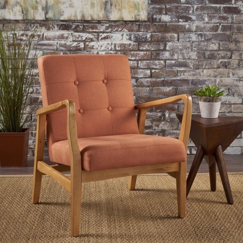 An image of a tufted club chair