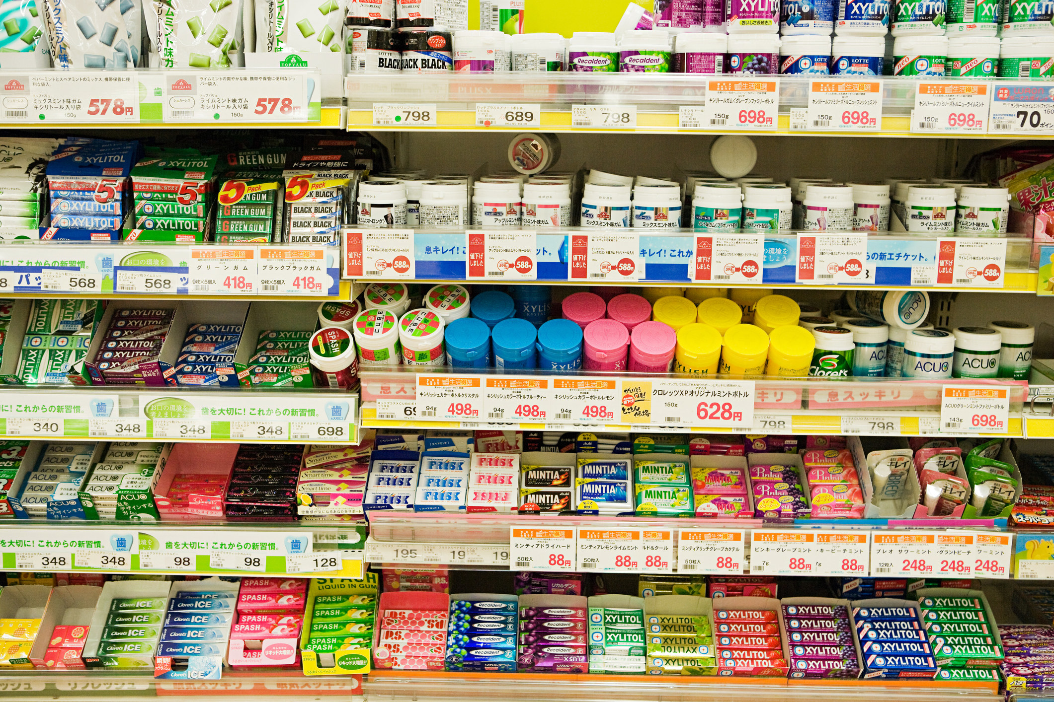 A display of products, including packages of gum, in an aisle