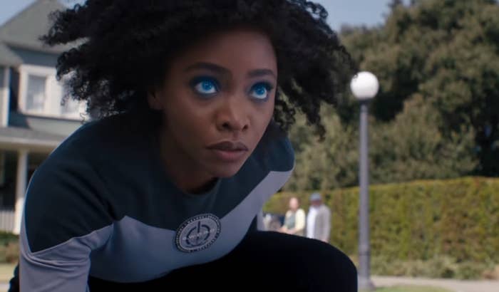 Monica Rambeau on one knee with her eyes glowing blue in &quot;WandaVision&quot;