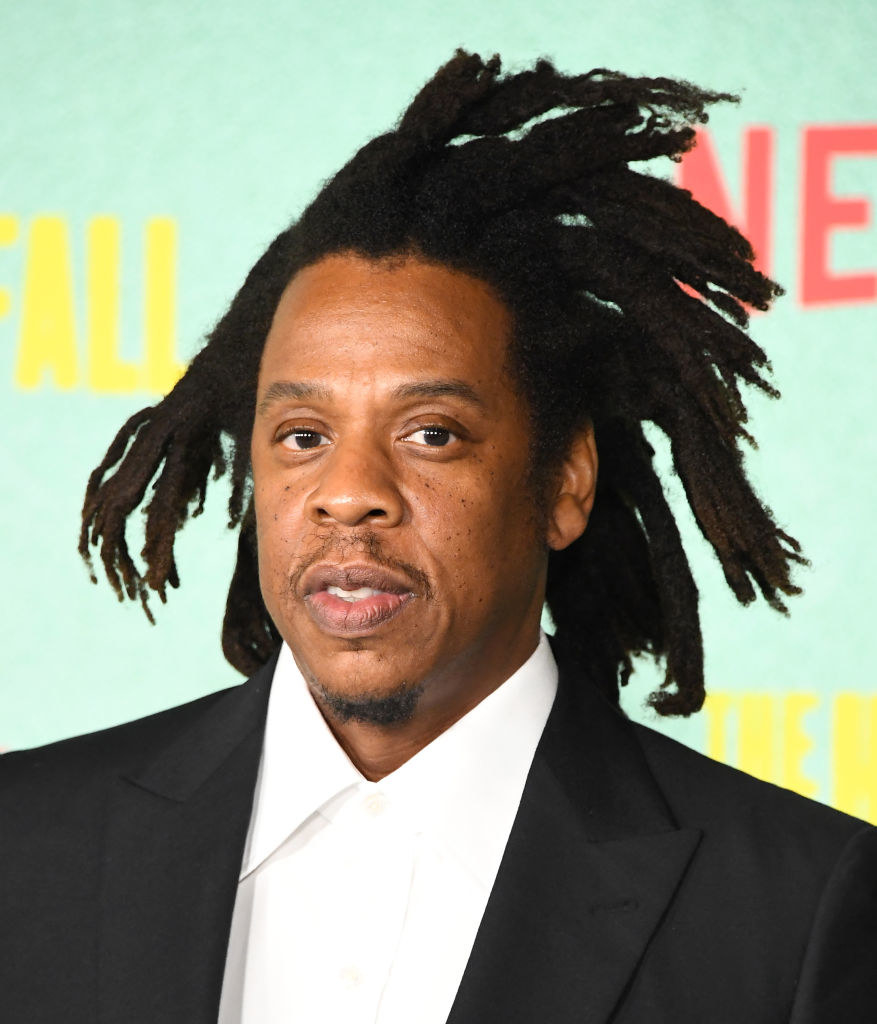 Jay-Z on a red carpet with wild hair