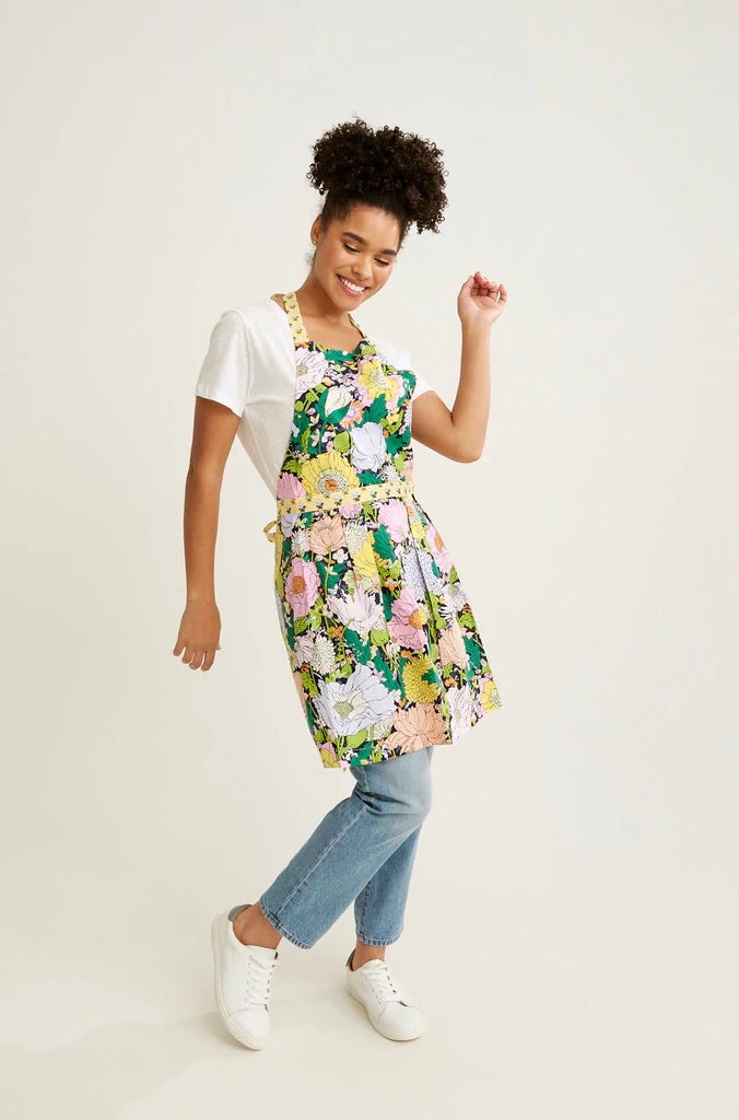 model posing in the floral apron