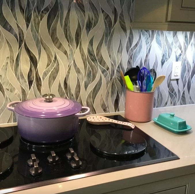 Reviewer image of purple Dutch oven on a stove