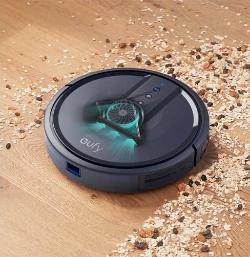 The Eufy vacuum cleaning up spilled cereal