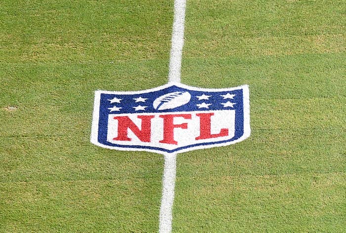 NFL Shield logo on a football field