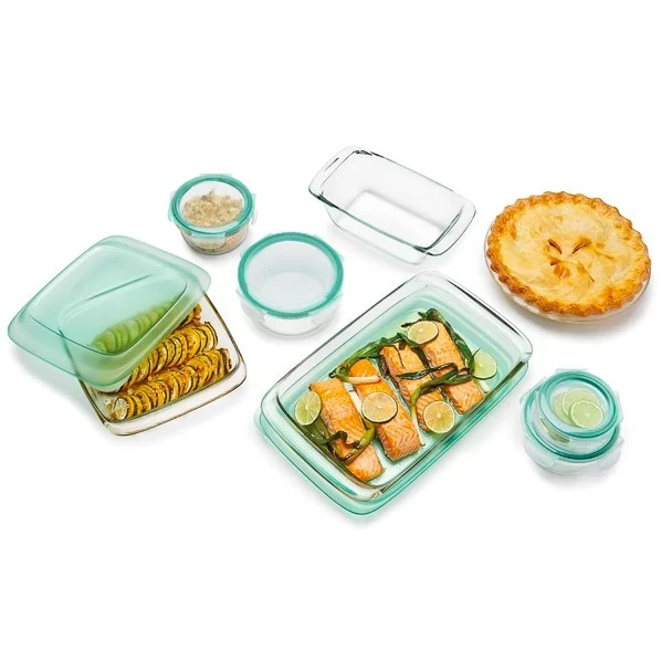 Glass containers filled with food next to turquoise lids