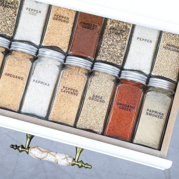 The matching spice jars neatly in a drawer