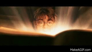 Daniel Radcliffe as Harry Potter in &quot;The Chamber of Secrets&quot; opening a diary that&#x27;s glowing and then sucking him in