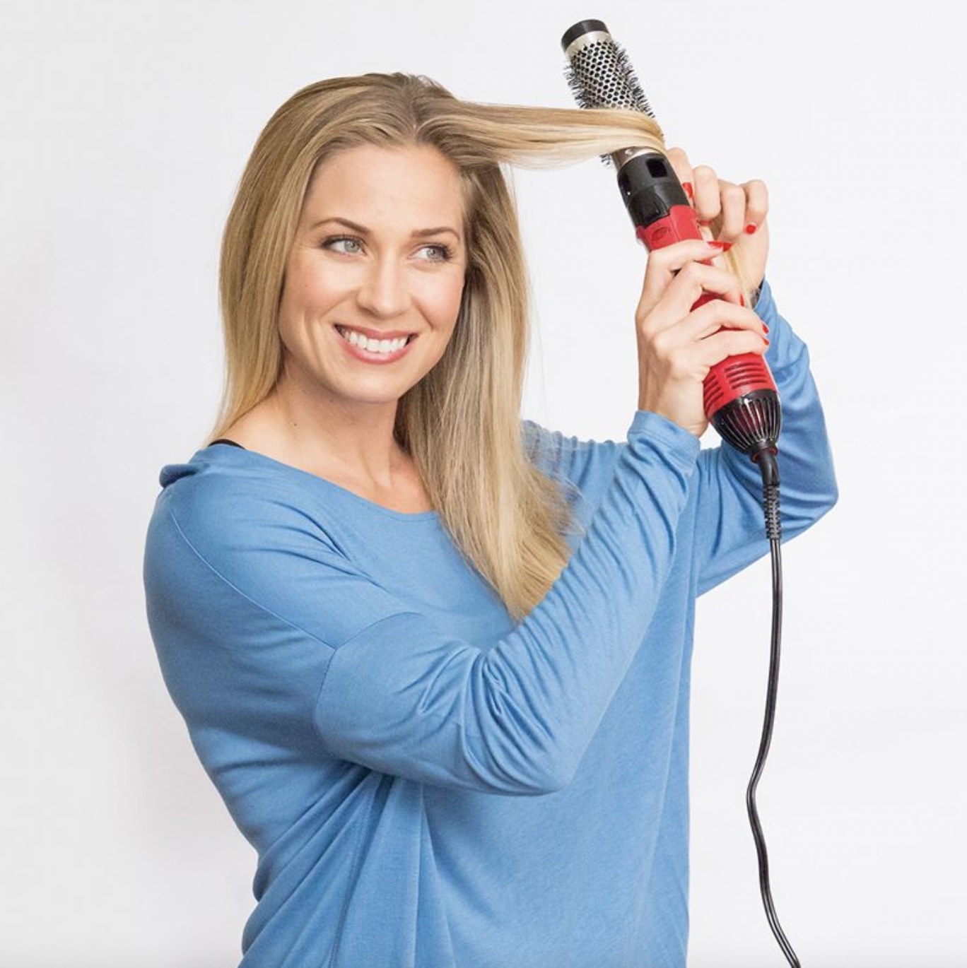 A person using a heatstyling tool
