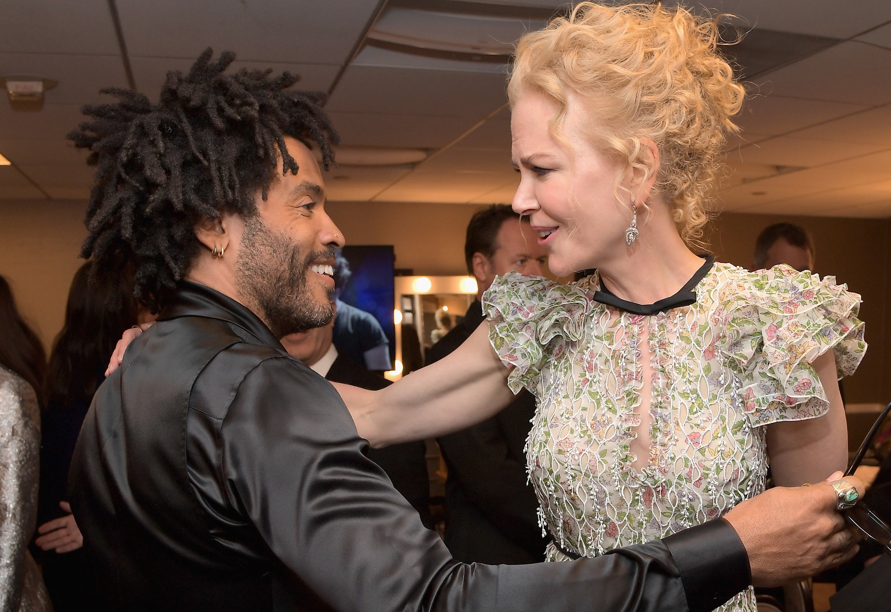 Lenny Kravitz and Nicole Kidman embrace in the green room during the Hollywood Film Awards