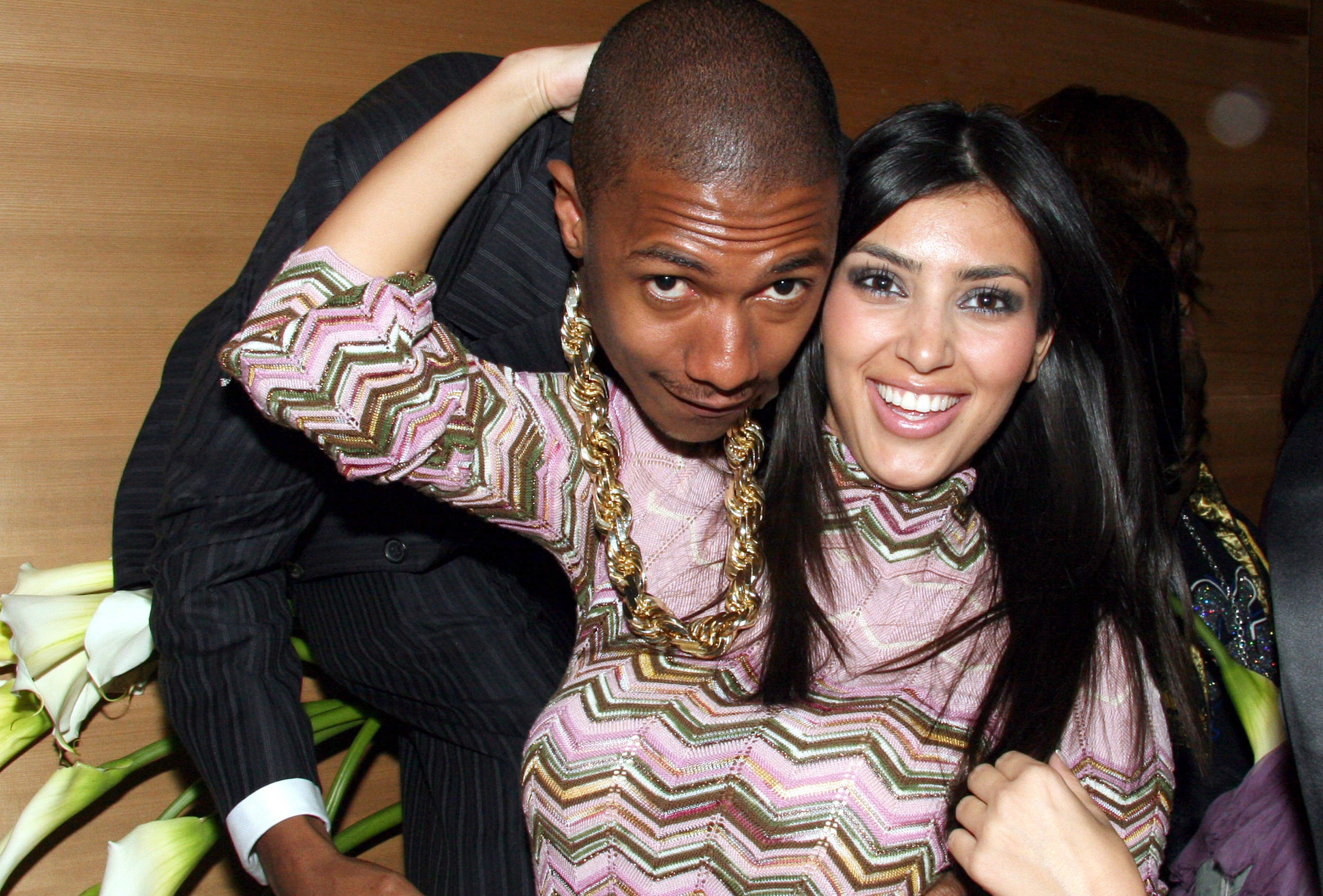 Nick Cannon and Kim Kardashian posing for a picture together