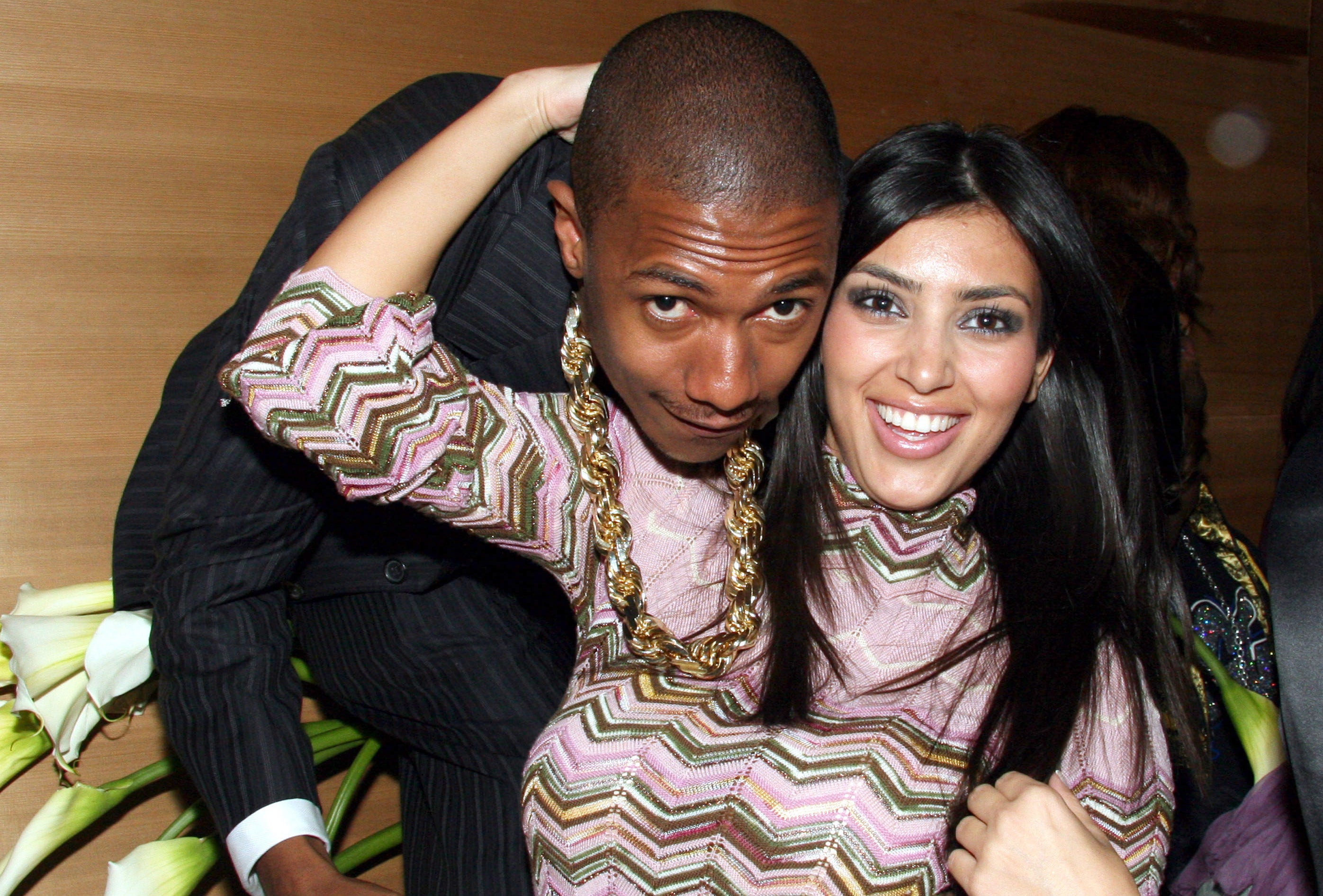 Nick Cannon and Kim Kardashian posing for a picture together