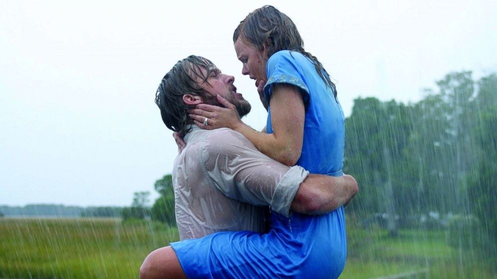 Ryan Gosling as Noah holding Rachel McAdams as Allie in his arms in the rain in &quot;The Notebook&quot;