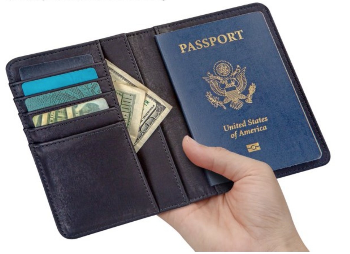 A model holding a passport holder