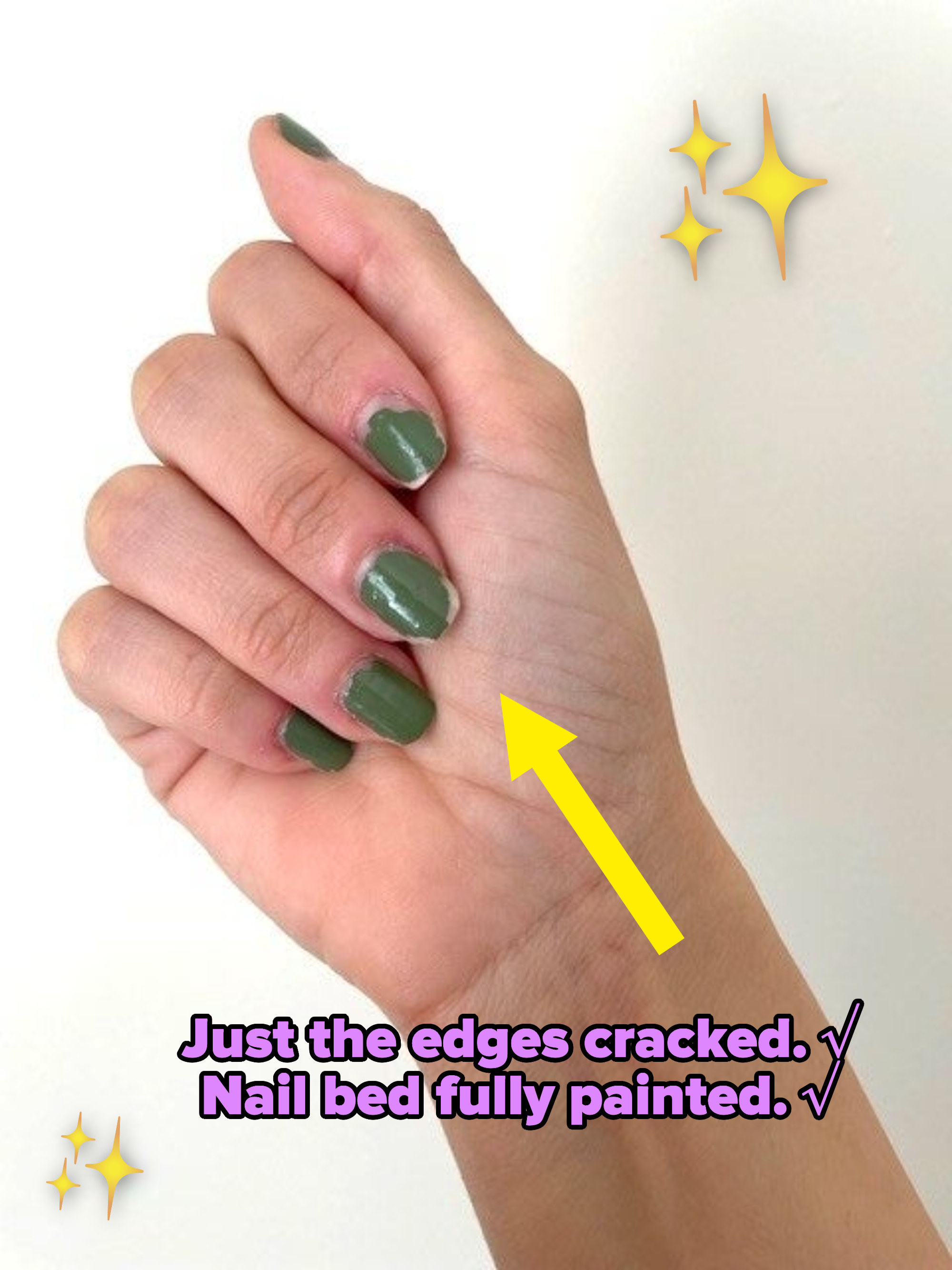 A closed hand showing green nail polish