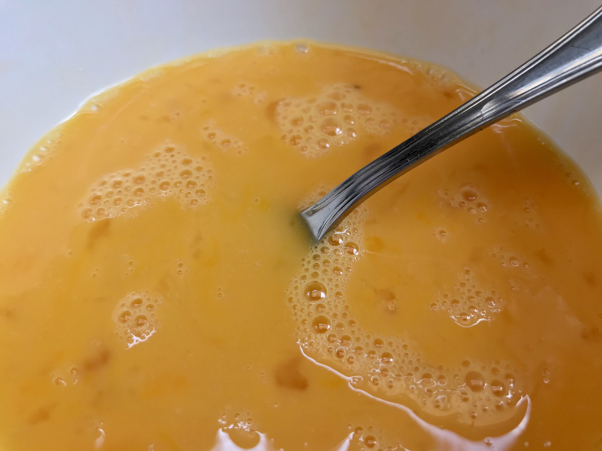 Beating eggs in a bowl