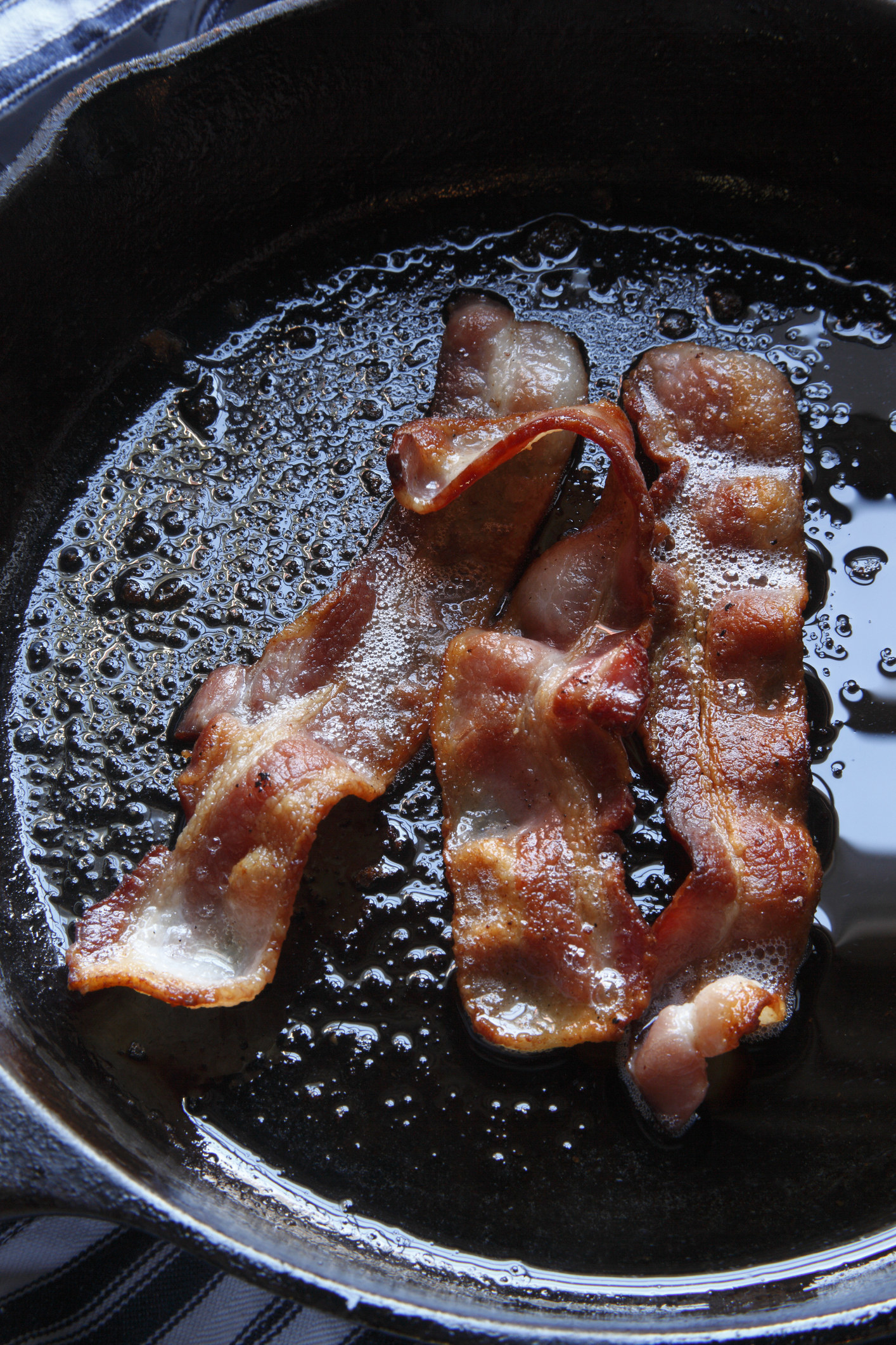 Bacon cooking in a skillet