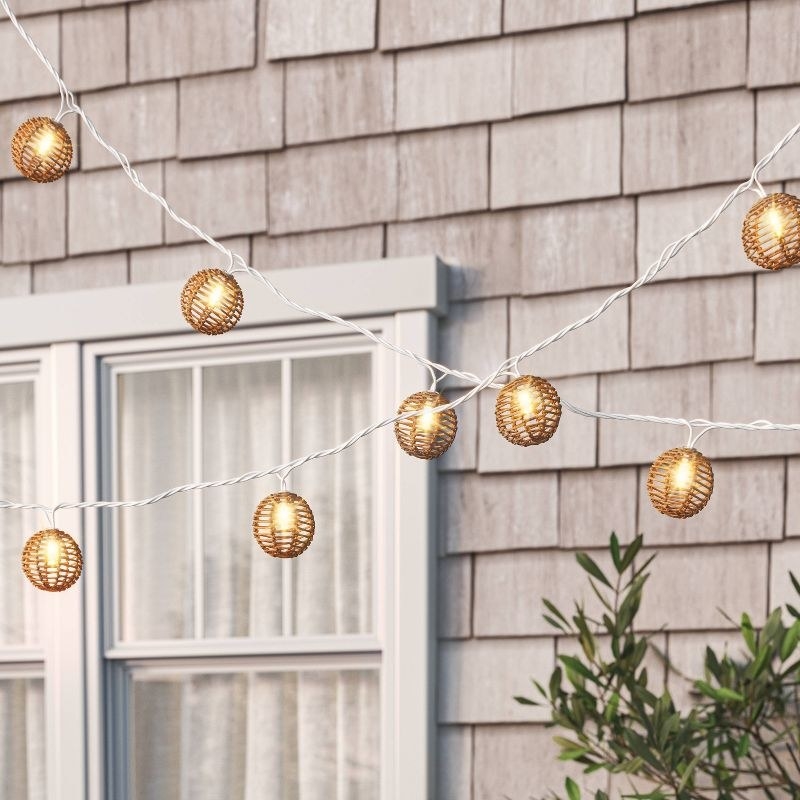 the string lights hanging outside of a house