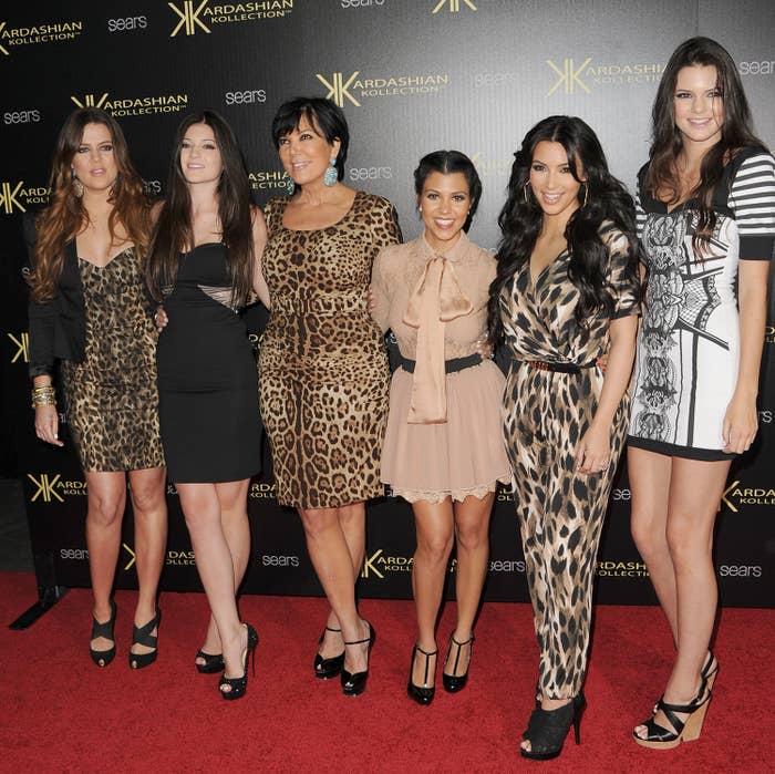 Some of the Kardashians posing at an event