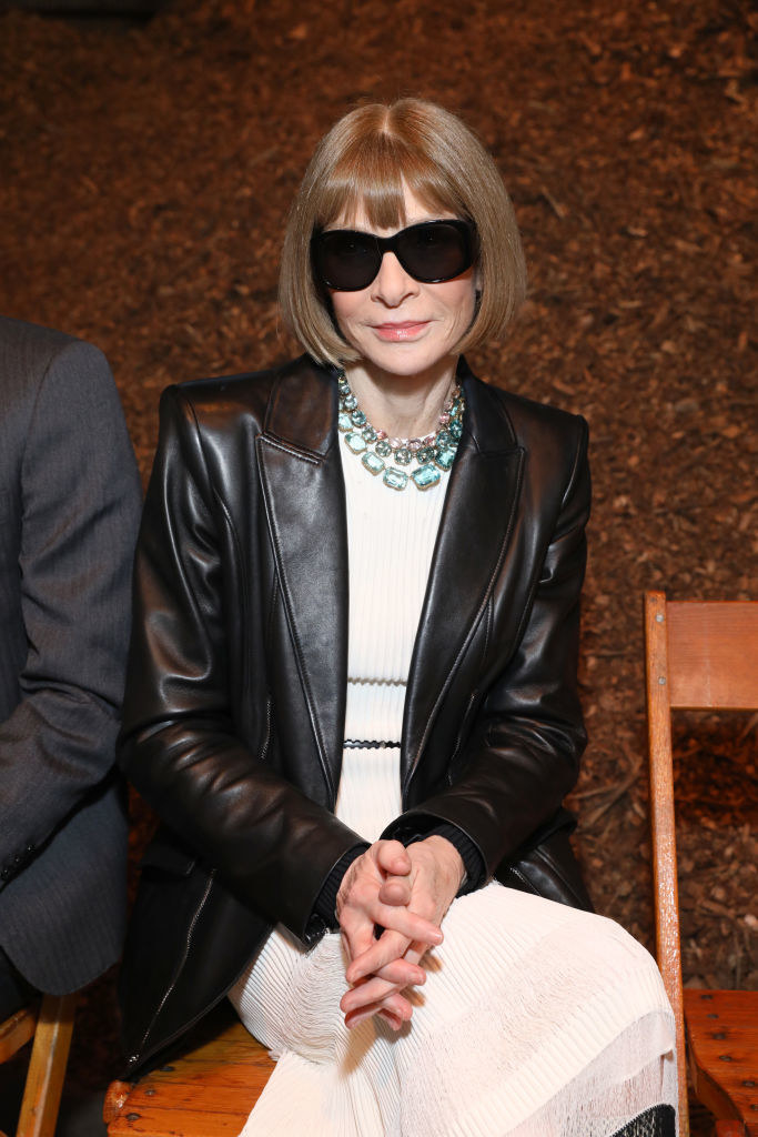 Anna Wintour sitting in a chair