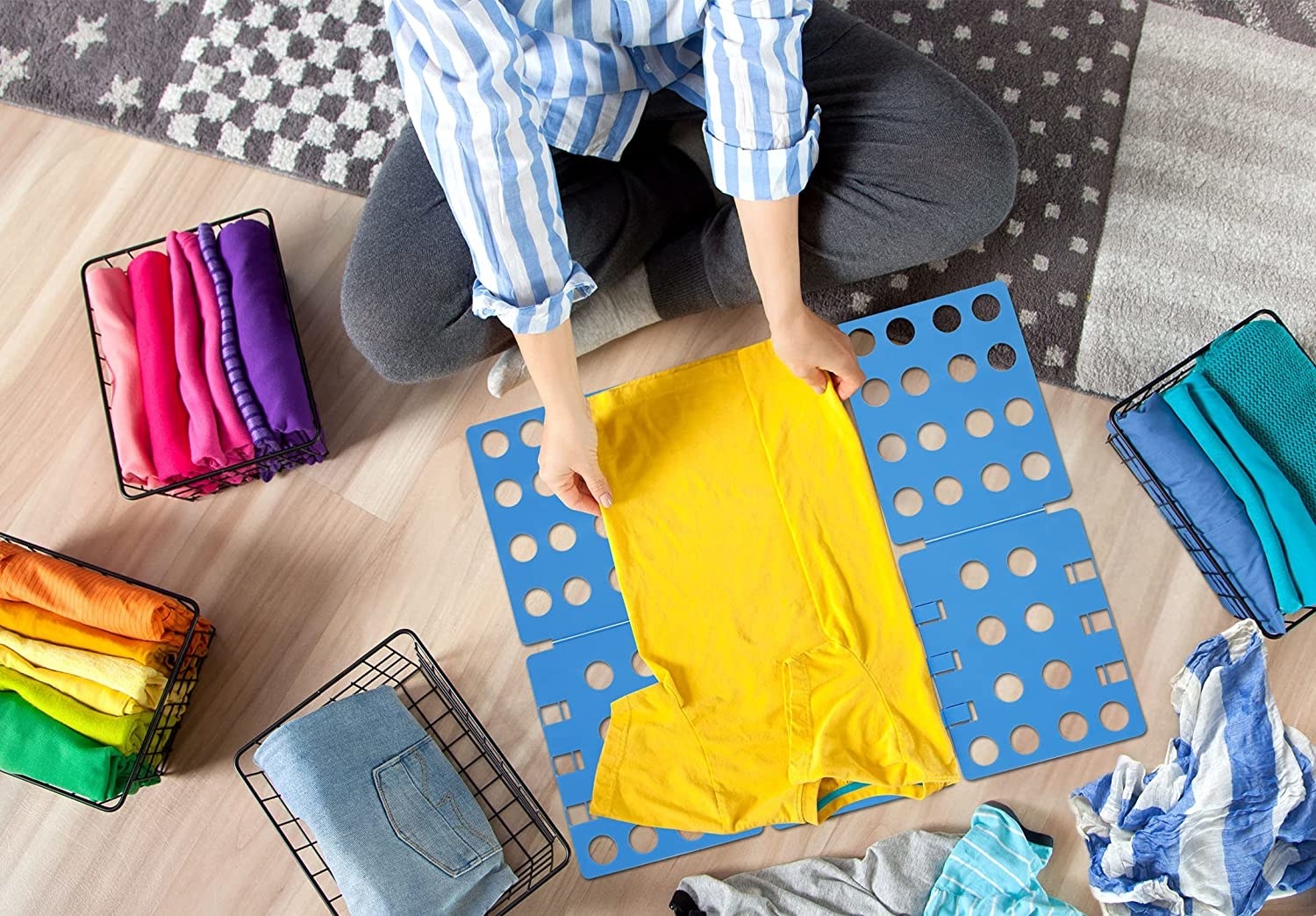 A person using the mat to fold clothes