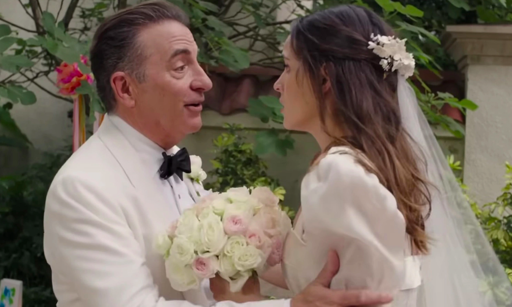 an older man talks to a young bride